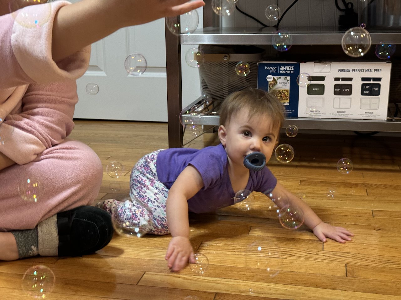 Zoe popping bubbles.
