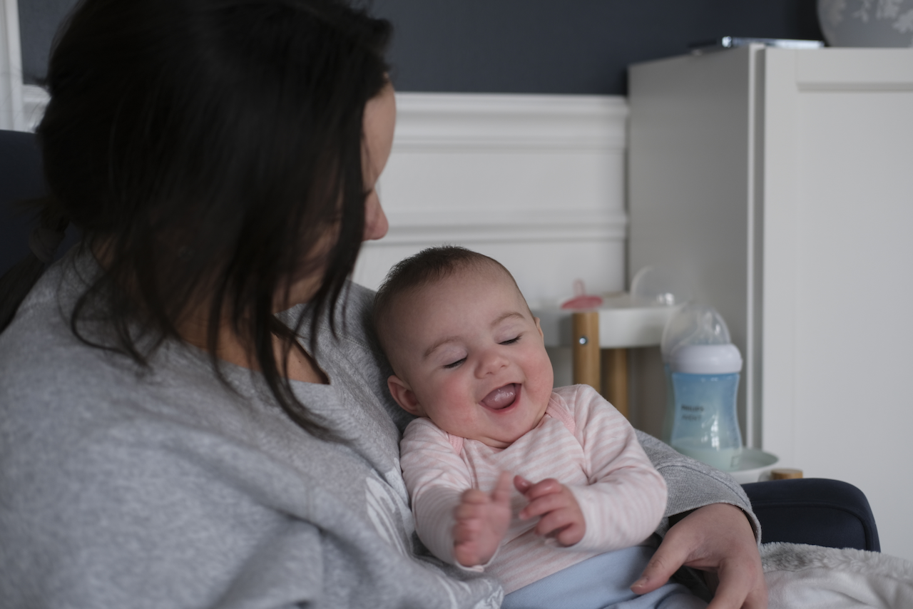 Zoe laughing with mom.